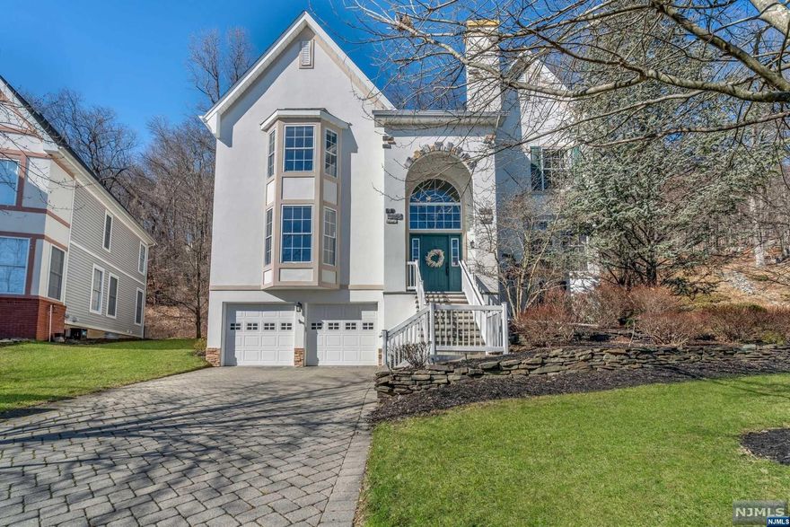 Nestled on over a half-acre natural setting on a cul-de-sac, this elegantly updated 5-bedroom Monroe model home in sought after Ramapo River Reserve is all about lifestyle. Gorgeous features include the sunlit 2-story foyer, chef's kitchen with dual-oven, crown molding & hardwood floors. The open concept first floor features a formal Living Room & Dining Room, Kitchen that flows to the large Family Room with dramatic gas Fireplace, convenient Office/Bedroom, 1/2 Bath, and Laundry Room. On the second floor there is a Primary Suite + WIC, second Bedroom Junior Suite/Fbth, 2 additional Bedrooms & hallway full Bath. The ground level 2 car Garage leads into a Mudroom, fabulous Media/Workout room, storage, & flex room with attached full bath. An outdoor entertainer's dream, the backyard features a large back Patio with built-in fire-pit. The Reserve offers a park-like setting along the Ramapo River. The community's facilities include Clubhouse, Gym and wonderful Outdoor Pool.