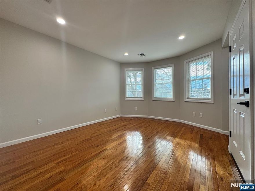 Beautiful and spacious 2nd floor apartment with recent updates. Large living room with private balcony. Two large bedrooms with plenty of closet space. Open eat-in kitchen and bathroom. High ceilings throughout. Upstairs includes another bedroom/bonus space. Laundry hookups in the basement. Includes 1 car parking space on driveway. Close to NYC transportation and parks!