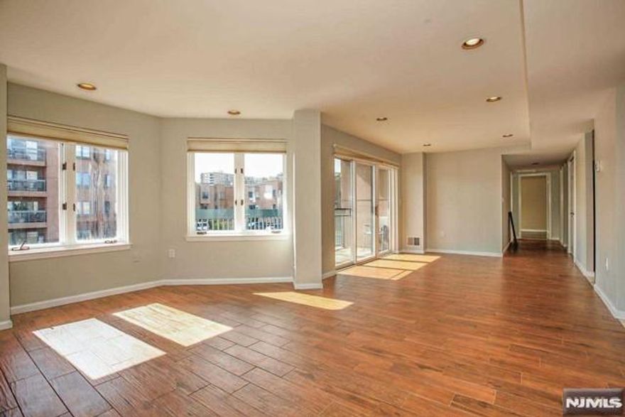 This Beautifully updated 2 BR, 2 Bath apt (1293 sq') with southern and eastern exposure. Featuring gorgeous wood floors throughout, primary bedroom with large walk-in closet, recently updated kitchen with 2 fridges, former dining room, breakfast area, Two balconies, Newer AC/Heat central air, Washer and dryer in unit, covered parking spot included in rent. Complex amenities include outdoor pool, Tennis courts, Gym, 24 Hours Gated security, and plenty of visitor parking spaces. NJ transit bus to NYC at front gate. Direct access to the Hudson Riverfront Walkway, walk to City Place and Edgewater Commons. Due at lease signing: 1 month rent, 1.5 month security. $500 building move-in fee and refundable $500 building moving day damage deposit. No pets. No smoking inside apt.