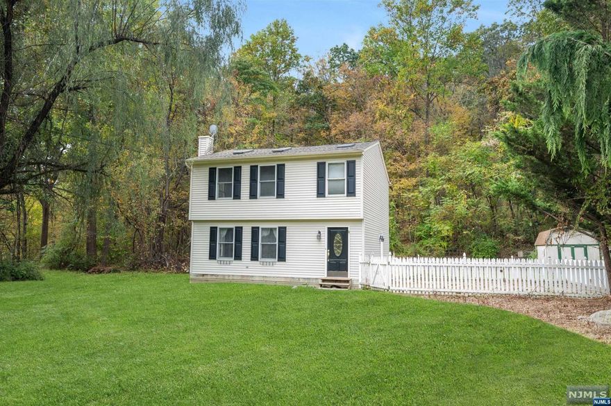 Looking for piece and quiet then look no further. Set at the end of a dead end street backed by woodlands this adorable colonial is just waiting for it's new owners. Featuring a true cooks kitchen with stone countertops, Italian marble tile, breakfast bar and a six burner stove that leads to the dining area with a large picture window. Through the French doors you'll find the very spacious living room. First floor also includes a full bath. On the second level are two generously sized bedrooms. Primary bedroom has large wall of closets with built in drawers and shelving and vaulted ceilings. Full bath with separate soaking tub and a true laundry room complete the second floor. Step through the sliding doors off the kitchen into your private backyard oasis. Large patio for entertaining and a built in out door prep area with grill and refrigerator, roomy shed for storage and ample yard space.