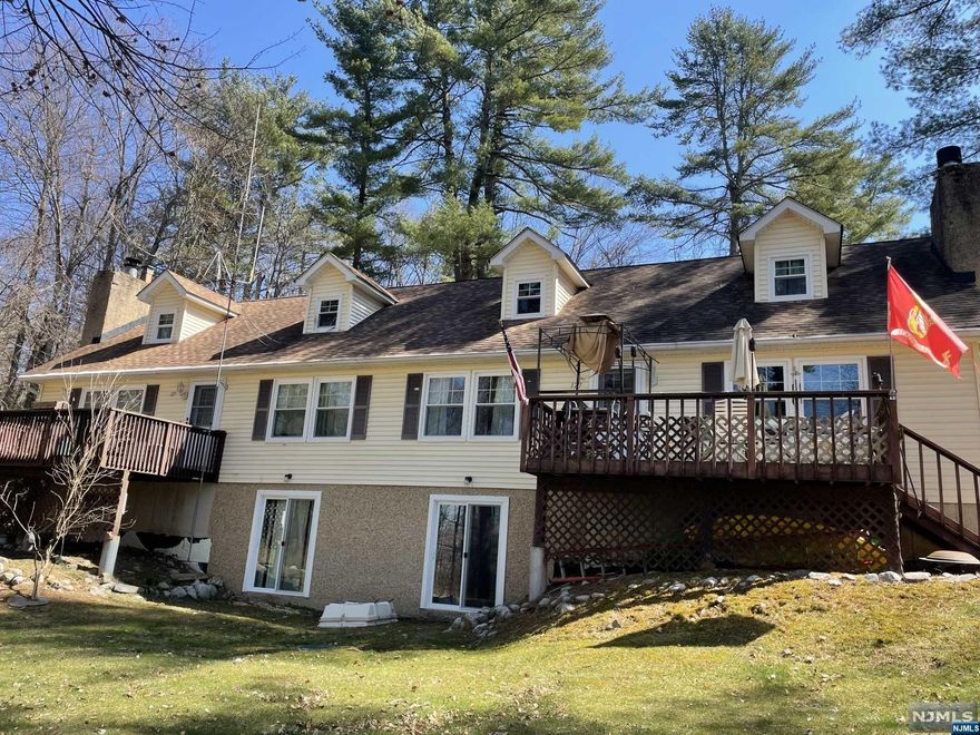 CALLING ALL INVESTORS. Welcome to this well-built side by side mirror image duplex. Each unit with its own separate entrance, separate utilities and new windows, and doors. Could be a great in-law suite. Each unit includes 2 Bedrooms, 1 bonus room/office, eat in kitchen, living room with wood burning fireplace and full walkout basement. Nice size yard. Each unit has its own deck allowing peace and quiet while providing beautiful views of nature. Big walk-out basement with high ceilings, includes washer and dryer hookup, offering plenty of room for storage. Home being sold with 1 tenants in place on month to month basis paying under market value rent. CAP rate could be 10% with a little TLC. Each unit has its own separate utilities. NOTE: Tenants would like to stay if possible. Septic plan shows 4 bedroom system design. No FHA mortgages permitted in this Community (Conventional or Cash only).