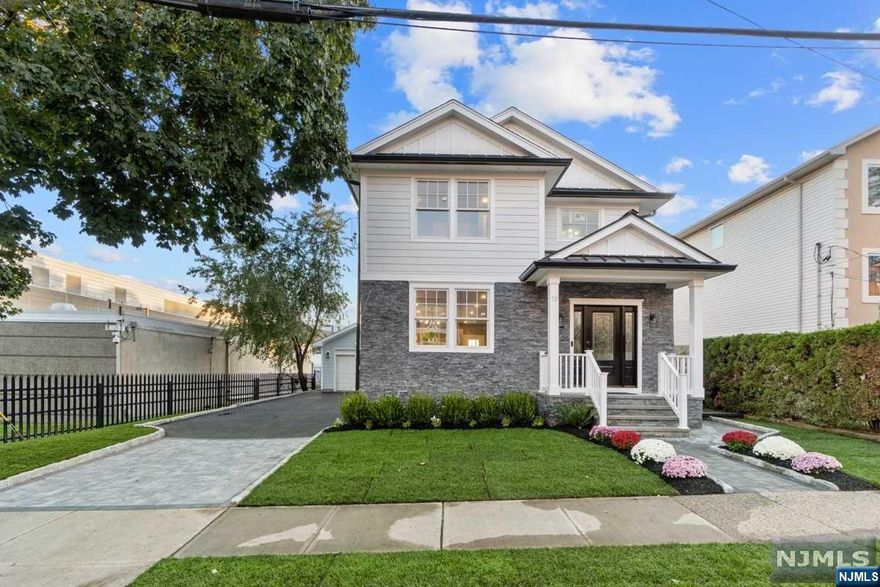 Welcome to a magnificent, almost brand-new home in East Rutherford, This immaculate residence boasts four spacious bedrooms, three modern bathrooms, and has been completely renovated from top to bottom. Its prime location near Rutherford train station offers seamless access only 30 minutes to NYC, making your daily commute a breeze. With a convenient one-car garage and room for an additional five cars in the parking area. Two zone central air/heat units. Don't miss this opportunity to own a beautiful, turnkey home in the heart of East Rutherford. It's the perfect blend of luxury and practicality. Close to MetLife's Stadium and American Dream Mall