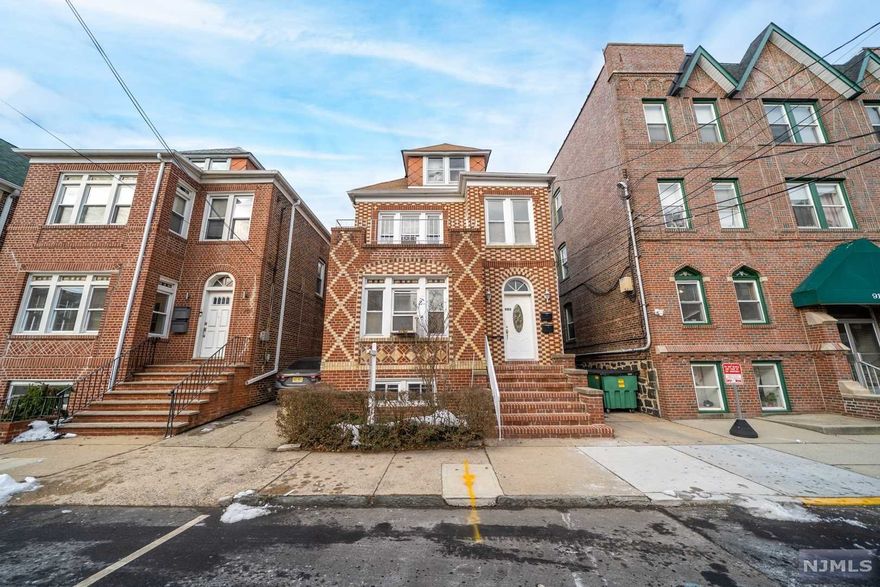 Welcome to this spacious 2 family brick home located in the desirable Racetrack Section of North Bergen! First floor apartment features a large living/ dining room, 2 bedrooms, bathroom and pantry. This floor also features a bonus space situated at the front of the house easily convertible to a home office, child's playroom, reading room, etc. Second floor apartment has large living/ dining room, 3 bedrooms, bathroom and pantry. Balcony accessible from 3rd bedroom for coveted private outdoor space. Original stunning hardwood floors throughout both apartments. Large, unfinished walk up attic with high ceilings and ability to finish for extra living space. Basement has a bathroom, rec room, and utility rooms, with separate entrance to exterior and ready for a user-owner or investor to enjoy. Private driveway plus 2 car detached garage Backyard and patio area. Easy access to NYC , local transportation, Braddock Park and dining.