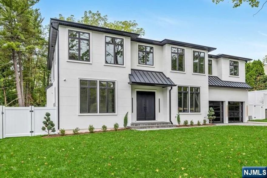 Spectacular brand-new construction colonial in ultra-desired Closter, offering 7 bedrooms & 7.5 baths with unmatched luxury and elegance. Built by highly reputable Gold Coast Builders, known for impeccable craftsmanship, and designed by Agape Interior Design Group to create stunning, inviting interiors. The spacious floor plan boasts soaring ceilings, intricate trim work, and custom moldings throughout. The gourmet kitchen is a chef's dream, featuring SubZero/Wolf appliances, custom cabinetry, and a large waterfall island, flowing seamlessly into the Great Room. The lavish primary suite offers a spa-like bath & custom WICs. Each bedroom is thoughtfully designed with ensuite baths for convenience and comfort. The basement includes a movie theater, gym, bedroom, full bath,& rec room. The covered patio is perfect for entertaining. For car enthusiasts, the 14' garage ceiling accommodates 2 car lifts. This home defines luxury living in one of Closter's most sought-after neighborhoods.