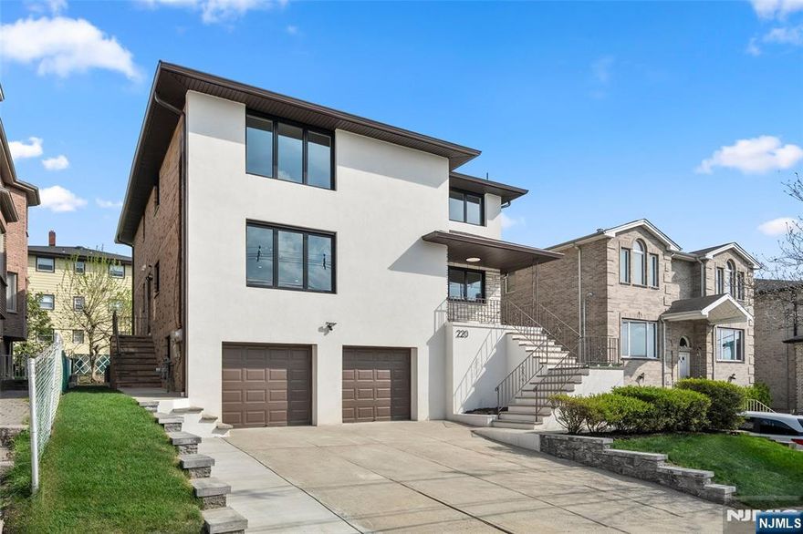 Total Turnkey Investment or Income-Producing Dream! This beautifully renovated, legal 2-family home in a prime Palisades Park location offers modern luxury and exceptional versatility. Perched high on 8th Street, the home is drenched in natural light with superior airflow and a breezy, elevated feel. Key Features Modern Interiors: Chef-inspired kitchens featuring sleek quartz countertops and custom designer cabinetry throughout. Income Versatility: Beyond the legal 2-family layout, enjoy a flexible ground-floor bonus unitâ€”complete with 2 potential bedrooms, 2 full baths, a private entrance, and a seamless walk-out to the backyard. Luxury Conveniences: Dedicated laundry facilities on every level for maximum tenant ease. Outdoor Living: A cozy, private backyard perfect for summer BBQs and relaxation. Parking: Ample space with a 2-car garage plus 3 additional driveway parking spots. Commuterâ€™s Paradise: Unbeatable access to major highways and a short walk to NYC transportation/buses. The Bottom Line Whether you are looking for a smart investment property with proven revenue potential or a home that pays for itself, 220 8th St is a rare find. Experience the perfect blend of style, convenience, and income stability.