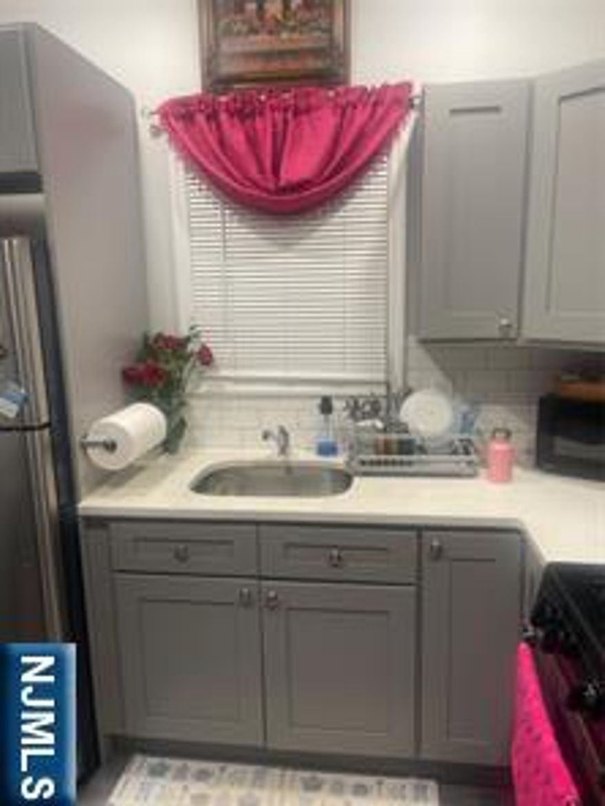 Discover the perfect blend of comfortable living and smart investing with this charming three-family home. Ideal for buyers eager to secure a beautiful residence for themselves while simultaneously enjoying the benefits of passive income, each of the three levels offers a private two-bedroom, one-bath unit with the added convenience of separate utilities. Live in one and let the other two units significantly offset your mortgage â€“ it's an intelligent path to financial freedom. motivated seller .