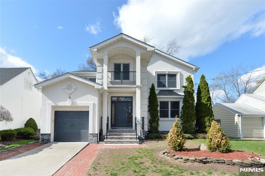 Welcome to this newly renovated in 2024-2026 contemporary style, 2 story with finished basement, 5 bedrooms and 4,5 bathrooms home in the highly desirable Radburn area of Fair Lawn. The Main Level Features Open Plan Concept Living room,Family room , Gourmet Kitchen, Dining RM, Spacious BDR, Full BATH and powder room. Living Rm w/ exit to new Deck & Yard. This gorgeous home features a modern style kitchen with stainless steel appliances, porcelain flooring, and quartz countertops matching the island. You have all the space you need with an En Suite bedroom on the 1st floor with its own private entrance, hardwood flooring throughout. The 2nd floor has 4 great size bedrooms including the primary En Suite with an the spa-inspired a freestanding tub, rain shower, and double vanity. . All bathrooms totally renovated in 2024 , brand new roof , deck and metal railing in 2026. A convenient laundry room on 2nd floor hallway. This residence blends style, comfort, and convenience just 12 miles from NYC and close to top-rated schools and transportation to NYC.