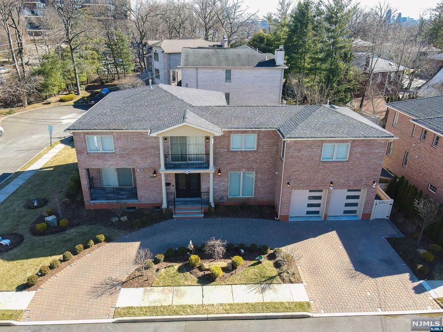 Luxurious Custom Built Home (2020), with the finest features, designs and details. Invite your guests to a most unimagined seating area overlooking open floors and walls of windows. This regal home centers around the kitchen with living spaces above and below. Two-tiered quartz island combined and balanced by quartz counterspaces. Large two and three story windows summon the sun and controlled by remote shades to perfect the amount of light you desire over the 4 levels of living spaces. The lower level features a full size lounge with wet bar located inside with full-width glass walls that open broadly expose access to the inground pool for the full resort experience.Guest room on the lower level with private bath & walk out to the exterior for personal access and privacy. The upper level consists of a sitting area towering atop of the home, two additional bedrooms and the master suite complete with balcony for those relaxing mornings. You will be sure to enjoy this home every day