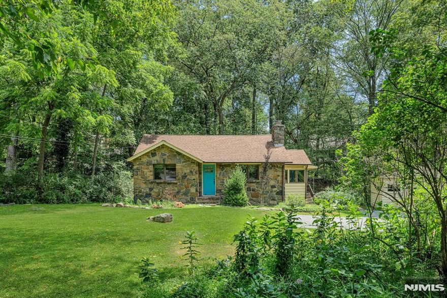 Cozy and convenient 1 floor living overlooking private backyard with babbling brook near Lake Valhalla. Hardwood floors throughout. Living room with vaulted ceiling and stone fireplace. Updated kitchen with granite counters, SS appliances and custom cabinets with pullouts. 2 spacious bedrooms with plenty of closets. Modern updated baths make this home ready to move righ in! Slate patio, lush plantings, long inviting driveway, detached 1 car garage. Desirable Montville is known for its Top Rated schools, excellent dining and shopping and easy 30 mile commute to NYC! Optional Lake Valhalla Club membership available.