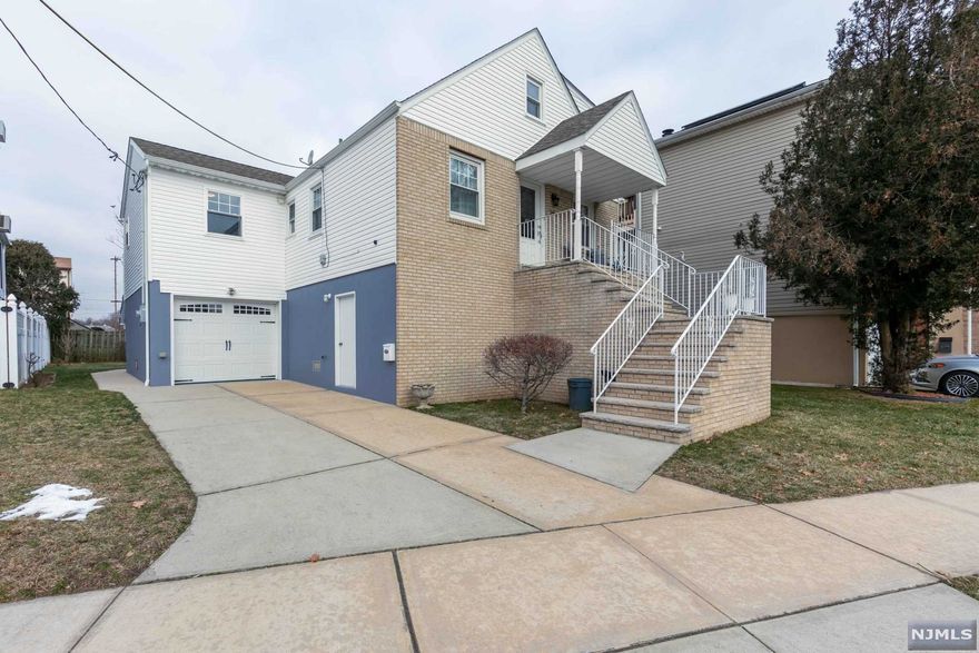 This home is more than just move-in ready, it is in impeccable condition! Offering 4 bedrooms and two newly renovated full bathrooms. Formal living room, kitchen with breakfast bar open to dining area and family room - an entertainers dream! Laundry room conveniently located on first floor. Spacious bedrooms - 2 on first floor, 2 on 2nd floor. Hardwood flooring throughout except for new carpeting in 1 bedroom and family room. Large deck perfect for grilling or sitting and enjoying the quiet neighborhood. Spacious ground level basement with porcelain tile floors and sliders open out to patio area and fenced-in private backyard with cherry tree. One block from the lovely Riverside Park with dog park, track and walking paths. Walking distance to train - only 4 blocks and 1 block to bus stop - 192/199. Home has been elevated & expanded with new foundation, 200 amp updated electrical, one car attached garage and driveway for add'l parking. Flood Insurance $650/yr already paid for 2022.