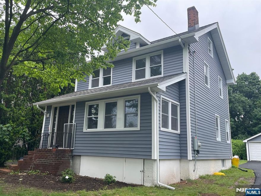 Recently updated Colonial on large park-like property, 151 foot deep. New vinyl siding and trim.Home has new roof and windows, floors and walls. The first floor features a heated enclosed front porch, living room with fireplace, open to dining room. Brand new quartz-countered kitchen. New half bath. The second floor has three bedrooms and a brand new full bathroom. There's also a walk-up, mostly finished attic; great for study or home office. New boiler, hot water heater and electric panel. New Central Air. Oversized two-car garage with brand new long driveway. Close to NYC buses, shops, parks and houses of worship. Room for a pool!