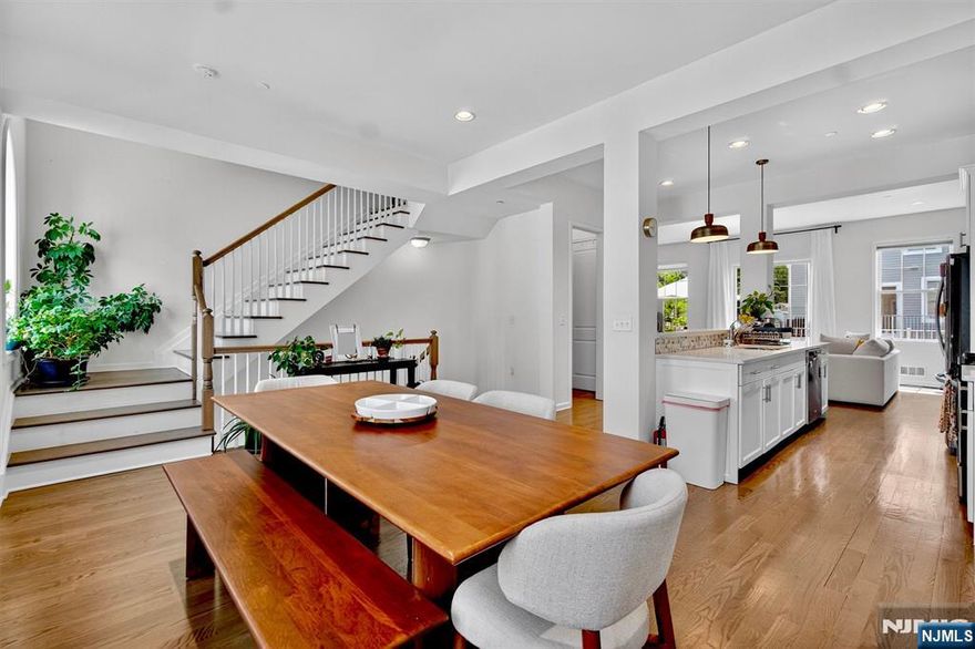 Available to rent from Sep 1st. Welcome to this beautiful Colonial-style Luxury Townhome in the highly desirable Wright Place community of Wood-Ridge. This Northeast-facing home is filled with upgrades and just 30 minutes from NYC, offering unmatched convenience with Wood-Ridge Train Station only 10 minutes away on foot and buses to NYC just a 4-minute drive, running every 10â€“15 minutes. A charming flower-lined path and lush green lawn welcome you to a 2-car garage with 2-car driveway. Inside, you'll find hardwood floors, recessed lights & ample sunlight from all windows. The first floor offers 9â€™ ceilings, 3 closets, and a junior suite with a full bath. An elegant arched staircase leads to the second floor with 10â€™ ceilings, oversized windows, a spacious living area, large dining room, dual-sided fireplace, and a modern kitchen featuring granite counters, stainless steel appliances, breakfast bar, and private outdoor deckâ€”ideal for entertaining. The third floor includes a large primary suite with custom his & her closets and full bath, 2 more bedrooms, full bath, and laundry area. Features 2-zone heating/cooling for custom comfort. Enjoy community amenities like green courtyards, playground, dog park, sports field, and more. Close to restaurants, parks, Catherine Doyle Elementary, and direct transit to NYC.