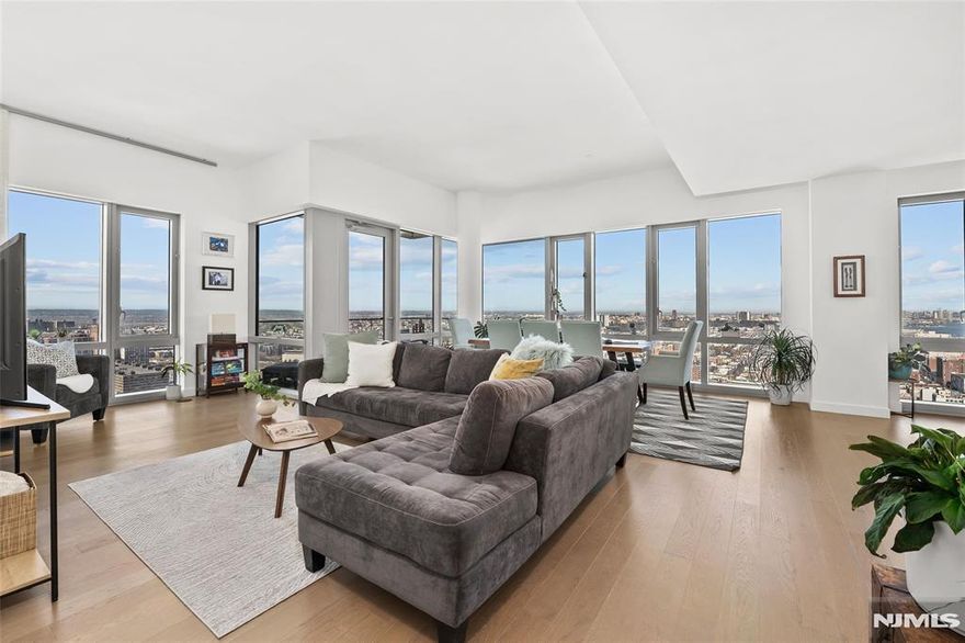 A rare penthouse resale at 75 Park Lane South. Residence PH 3701 is a stunning 2-bedroom, 2.5-bath corner penthouse spanning 1,481 sq ft with an 80 sq ft private terrace. Wrap-around floor-to-ceiling windows and high ceilings frame breathtaking panoramic views of the Hudson River, the Manhattan skyline, Hudson Yards, the George Washington Bridge, and the Jersey City skyline, with spectacular sunsets. The expansive living and dining area is ideal for entertaining and features a chefâ€™s kitchen with Madreperola Quartzite countertops, a waterfall island, premium Bosch appliances, and a rare exterior-vented hood. The primary suite offers sweeping city views, a walk-in closet, and a spa-inspired bath with Stellar White marble, frameless glass shower, soaking tub, and custom vanity. The second bedroom includes an ensuite bath. The home offers generous closet space and a private storage locker. Residents enjoy full-service luxury living with a 24-hour doorman, indoor lap pool, fitness center, spa with steam and sauna, wine lounge, private dining room, co-working and conference spaces, multimedia lounge, golf simulator, putting green, and landscaped rooftop sky lounge. Ideally located near the PATH Train, Light Rail, ferry, parks, shopping, and dining for easy access to Manhattan.