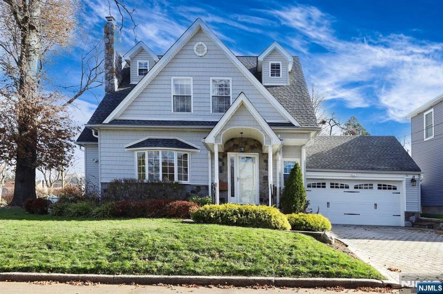 Beautiful colonial home exudes curb appeal and pride of ownership, located in the most desirable section of Bergenfield. Recently renovated and exceptionally well cared for, the home offers a welcoming atmosphere throughout. The main level features a cozy living room with a wood-burning fireplace, a formal dining room, and a spacious gourmet kitchen w/eat-in area. Also, on this level a guest suite w/full bath & walk-in closet; A nice size family room opens to an all-fenced backyard. The 2nd floor offers 3 large bedrooms w/WIC and additional alcove. A full bath and another 1/2 bath are also on this level. The lower level offers a recreation area w/access to the back yard, a guest room, full bathroom, and laundry. All house generator, central A/C, sprinkler systems, newer roof, new furnace, hot water heater, solar panels for lower electrical bills and many more amenities.