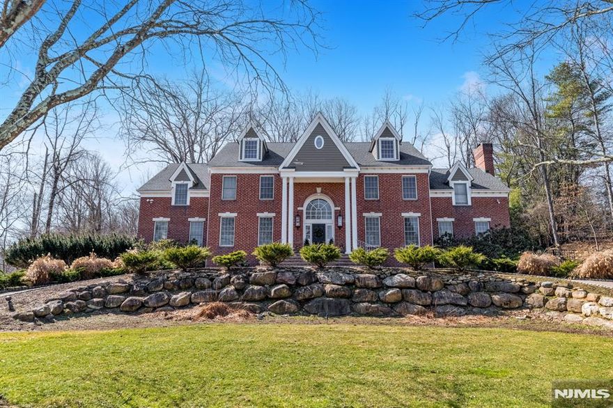 Stunning Center Hall Colonial set on a quiet double cul-de-sac on over an acre of property in one of Upper Saddle Riverâ€™s most desirable locations. Offering over 5,500 sq ft plus a finished basement, this impressive home features 5 bedrooms and 5.5 bathrooms and is ideal for both everyday living and large-scale entertaining. A grand two-story foyer welcomes you and leads to the formal living room/office and banquet-sized dining room. The spacious kitchen features a large center island and breakfast area, and flows into the impressive great room with fireplace, wet bar, and French doors opening to an expansive deck overlooking the private backyard. The main level also includes a bonus room/ playroom plus a first floor guest bedroom with full bath, powder room, and laundry room. The second level features a newly renovated spacious primary suite with sitting area, dressing area, and en-suite bath. Also on this level is a second en-suite bedroom, two additional bedrooms, and a full bathroom. The finished lower level offers excellent additional living space with a bar, office/den, full bathroom, and plenty of storage. Beautifully landscaped property set in a very private setting, plus a 3+ car garage ideal for car enthusiasts. A wonderful opportunity to own a spacious home in one of Bergen Countyâ€™s most sought-after towns.