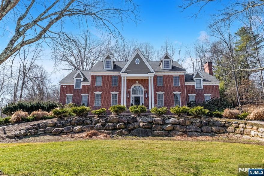 Stunning Center Hall Colonial set on a quiet double cul-de-sac in one of Upper Saddle Riverâ€™s most desirable locations. Offering over 5,500 sq ft plus a finished basement, this impressive home features 5 bedrooms and 5.5 bathrooms and is ideal for both everyday living and large-scale entertaining. A grand two-story foyer welcomes you and leads to the formal living room/office and banquet-sized dining room. The spacious kitchen features a large center island and breakfast area, and flows into the impressive great room with fireplace, wet bar, and French doors opening to an expansive deck overlooking the private backyard. The main level also includes a first floor guest bedroom with full bath, powder room, and laundry room. The second level features a newly renovated spacious primary suite with sitting area, dressing area, and en-suite bath. Also on this level is a second en-suite bedroom, two additional bedrooms, and a full bathroom. The finished lower level offers excellent additional living space with a bar, office/den, full bathroom, and plenty of storage. Beautifully landscaped property set in a very private setting, plus a 3+ car garage ideal for car enthusiasts. A wonderful opportunity to own a spacious home in one of Bergen Countyâ€™s most sought-after towns.