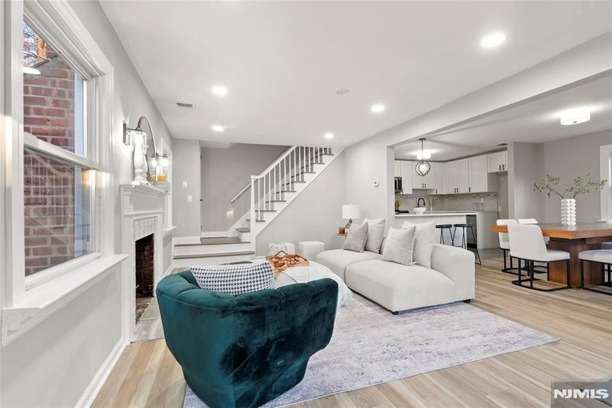 eautifully updated and move-in ready, this inviting Wayne home offers the perfect blend of style, comfort, and functionality just a few blocks from Packanack Lake and its sought-after amenities. A bright open layout, recessed lighting, and tasteful modern finishes create a warm and welcoming atmosphere throughout. The living room, centered around a striking fireplace, flows seamlessly into the dining area and renovated kitchen featuring white shaker cabinetry, stone countertops, stainless steel appliances, subway tile backsplash, and generous prep space, making it ideal for both everyday living and entertaining. A separate family room provides additional flexible living space, perfect for relaxing, gathering, or working from home. The spacious primary bedroom retreat features a vaulted ceiling, skylight, large mirrored closets, and sliding glass doors leading to a private balcony overlooking the backyard. An enclosed sunroom offers the perfect all-season space to unwind or entertain while enjoying views of the deep, tree-lined property. The lower level adds even more versatility for recreation, storage, or a home gym. Conveniently located near shopping, dining, parks, and major commuting routes, this home is a wonderful opportunity in one of Wayne's most desirable settings