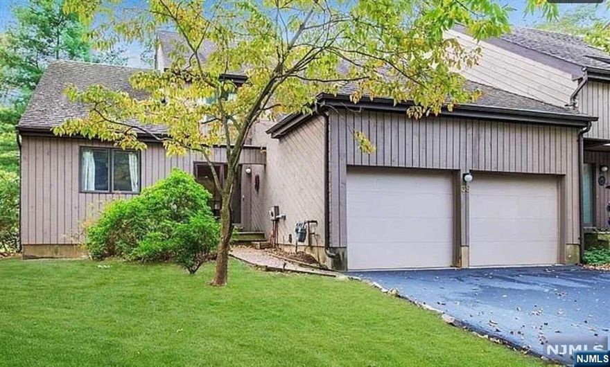 Beautifully updated 3-bedroom, 2.5-bath end-unit townhome in the coveted Windmill Pond community, just one mile from downtown Morristown's vibrant shopping, dining, and entertainment. This home offers upscale features, amenities like an outdoor pool and jogging path, and a lifestyle to love. The sunny, open-concept main floor boasts oak hardwood floors, recessed lighting & a renovated kitchen with sleek white cabinets, quartz countertops, and an oversized island with seating. The sunken family room features a vaulted ceiling, skylights, a cozy fireplace, and sliding doors to a deck, perfect for coffee or gatherings. The main level includes a primary suite w/vaulted ceilings + an en-suite bath, a laundry closet, half bath & covered porch. Upstairs, find 2 spacious bedrooms, one with a private balcony, and a full bath. Additional perks include an oversized 2-car garage, a new roof & a refreshed exterior. Close to top-rated schools, parks, golf & NYC trains, this home has it all!