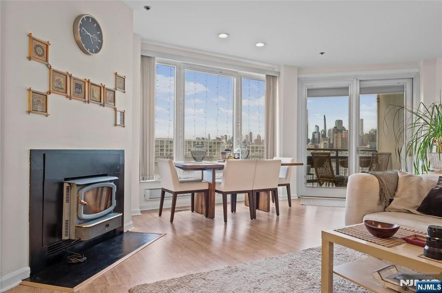 Beautifully renovated 2-Bedroom, 2.5-Bath townhouse-style residence in the prestigious community of Riva Pointe. This waterfront home in Weehawken offers stunning views of the Manhattan skyline and Hudson River, blending modern elegance with comfort. The open-concept living area features wood floors, a wood-burning fireplace, and large windows that fill the space with natural light. The gourmet kitchen is complete with granite countertops, stainless steel appliances, and rich wood cabinetry â€” perfect for both cooking and entertaining. The spacious primary suite includes a large walk-in closet and a spa-inspired en-suite bath with vanity and shower. The second bedroom also features a bathtub, providing comfort and privacy for guests or family. Enjoy your morning coffee with the sunrise from your private balcony overlooking the water on the Gold Coast. Additional highlights include in-unit washer/dryer, central A/C, and one garage parking space. Riva Pointe offers luxury amenities such as a 24-hour concierge, indoor heated pool, fitness center, and waterfront promenade. Ideally located steps from the NY Waterway Ferry, Light Rail, and major bus lines â€” with shopping, dining, and Whole Foods nearby â€” this home delivers the ultimate blend of convenience and lifestyle on the Hudson waterfront.