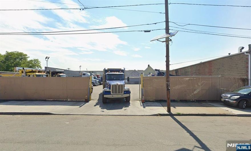 12,500 sq ft blacktop fenced in, ideal for trucks, storage and equipment