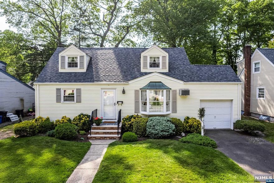 Do not miss this meticulously maintained and expanded cape cod home being offered for the first time by its' original owners! The home features over 1650 sf of living space including an open & sunlit LR/DR with new sliding glass doors to expansive deck overlooking beautiful yard, a full rear dormer which provides for two oversized 2nd flr BRs, and tastefully renovated bthrms on 1st and 2nd flrs. Lg bsmnt w/great pot'l to finish, new high efficiency heating systems, new roof, spacious yard w/deck & room for a pool! This hidden gem is nestled in a private circle that borders Borg's Woods Nature Preseve yet is only three blocks to express NYC transportation!