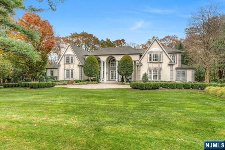 Experience opulent living in the heart of Franklin Lakes, one of Bergen County's most sought-after neighborhoods. Crafted by renowned builder John Avenzato. The interior impresses with double-height ceilings, hardwood, and expansive windows framing the lush front and back yards. This 8,000sf masterpiece includes a large-scale living and dining room, family room with FPL, library with FPL, a gourmet kitchen w/breakfast room. Every inch of this home exudes elegance and sophistication. Enjoy a seamless indoor/outdoor living with French doors opening to the beautifully landscaped grounds, complete with gunite heated pool. Finished walk-out lower level is perfect for entertainment and everyday life.