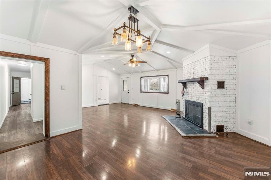 Welcome to this attractive multi-family property in a sought-after Clifton neighborhood, perfect for end users or investors. Set on a corner lot, it boasts a spacious backyard ideal for relaxation or entertaining. The first floor features an oversized unit with three bedrooms, including a primary bedroom with cathedral ceilings and a skylight. The living room offers high ceilings with unique wood accents and plenty of sunlight. A recently renovated bathroom adds custom details. Upstairs, a large bedroom is filled with light, and the open-concept kitchen, dining, and living area is impeccably maintained. The finished basement includes a laundry area and a versatile recreation room. The backyard is easily accessible from the first floor, providing a peaceful retreat for homeowners. Private driveway available for 3 cars. Public transportation is about a block away and home has easy access to the GS Plaza and other major routes. Minutes away from restaurants, stores and markets. Property will be delivered vacant at closing. Call and book your appointment today.