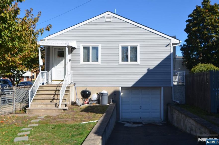 Beautiful, well maintained corner property. Main level features open concept Kitchen with quartz countertops, large living room with hardwood floors, 3 bedrooms, 1 full bathroom, central A/C; washer/dryer hook ups, storage space. Basement has 1 full Bathroom, Family room, attached garage and additional parking for 3 cars, centrally located near transportation, restaurants, shopping and more. Will not last., text listing agent for appointment Juan Tobar (201) 232-0272.