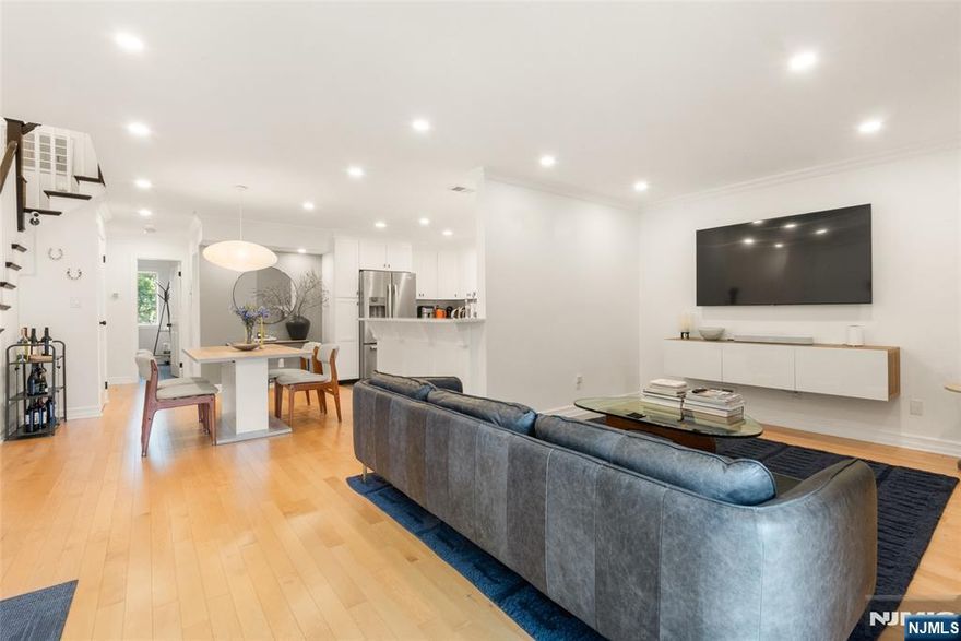 Fully renovated two-level 3 bedroom, 2 bath townhome in East Rutherford with Canadian hardwood flooring and recessed lighting throughout. The main level features an open living and dining area that leads to a private balcony, plus a newly renovated eat-in kitchen with stainless steel appliances and quartz countertops. A bedroom, a fully renovated bath, and in-unit laundry complete this level. Upstairs you will find two spacious bedrooms, a bonus den area, and a second renovated full bath.