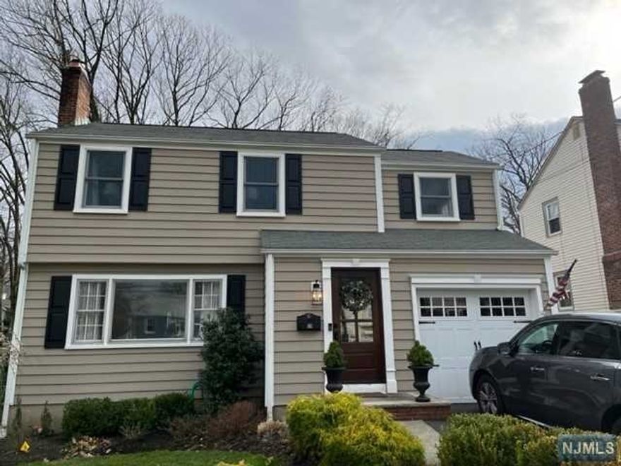 Welcome to this beautifully updated colonial. Step Into the entry way into the formal living room with recessed lighting, wood flooring and a lovely wood-burning fireplace with custom mantle and surround. (New fireplace liner 2017.) Formal dining with wood flooring, recessed lighting. New kitchen, powder room/laundry done in 2020. Kitchen has gleaming white cabinetry, white quartz counters new backsplash. Recessed lighting. All SS appliances. Convenient back door to new paver patio. On the second floor there is a large primary bedroom with sitting area and two additional bedrooms. Wood flooring throughout. Upstairs main bath is beautifully updated with white subway tile, white marble flooring and marble top vanity. The attic has pull-down stairs for convenience and a cedar closet. There is a large, unfinished basement just waiting for your touch! The outdoor area boasts new paver patio, walkways and landscaping. (2020) New Central air/heat 2021, new nest thermostat, new driveway.