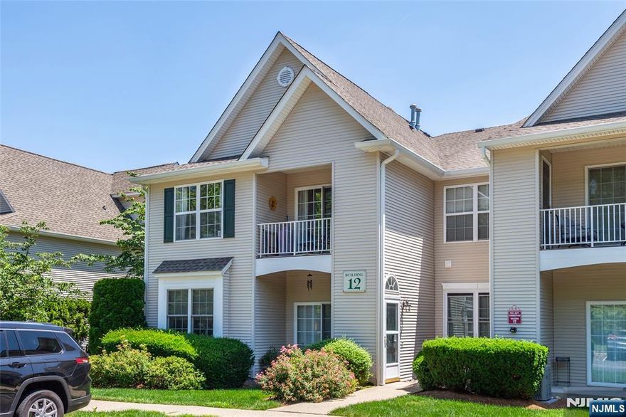 Welcome to this BEAUTIFULLY updated 2 Bedroom, 2 Bath End Multi Floor Unit in the desirable gated community of Cambridge Heights in Butler, NJ! This upstairs unit offers privacy, ample parking and a serene balcony overlooking a treed area, perfect for relaxing. The entryway features charming beadboard and chair rail, leading to a main level with custom crown molding and chair rail throughout. The updated kitchen includes newer stainless steel appliances, granite countertops, a large island, soft-close cabinetry, and a classic subway tile backsplash. Enjoy the dramatic cathedral ceiling in the dining area and cozy up by the stunning stone-accented fireplace with an electric crystal-insert. Both bathrooms feature vinyl plank flooring, with a jetted tub in the primary bathroom. A spacious loft with double windows offers a perfect flex space for an office or guest area. Additional upgrades include wide-plank laminate floors, newer AC unit, water heater , and full size washer/dryer, plus a brand new furnace (with warranty) to be installed prior to closing. Enjoy resort-style amenities including a clubhouse, gym, outdoor pool and fishing in the lake in this secure, well maintained community. Nothing to do except unpack and enjoy!