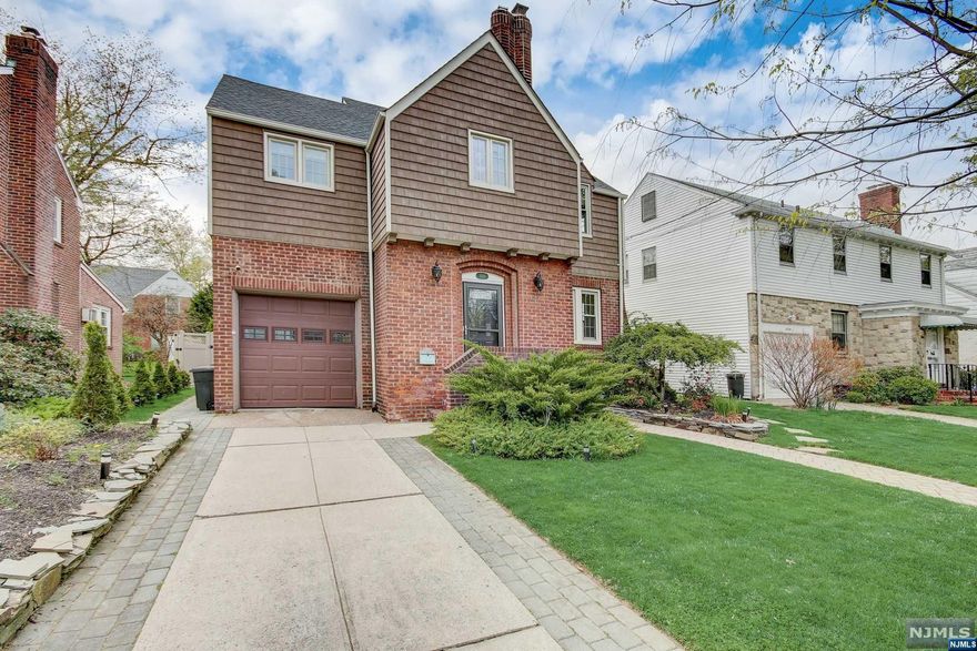 Located in one of the most desirable areas of Teaneck, with winding tree lined streets and beautifully maintained homes. Stunning renovations with attention to detail and quality. Completely updated kitchen, bathrooms, finished basement, heating, Central A/C and much more. Spacious living room with a brand-new fireplace, hardwood floors throughout, a gorgeous new kitchen with an eating area and breakfast bar which opens to a full size dining room, leading to a sun room/den. Upstairs you'll be met with three large bedrooms, great closet space and a beautiful new bath with double vanity and Jacuzzi. The basement is beautiful and new with a full bath, high ceilings, laundry area, rec room and storage. A spacious fenced yard for privacy with a brand new brick patio and firepit just perfect for outdoor gatherings. Close to Holy Name Hospital, bus to NYC, shopping, and all major highways. Simply perfect!!!