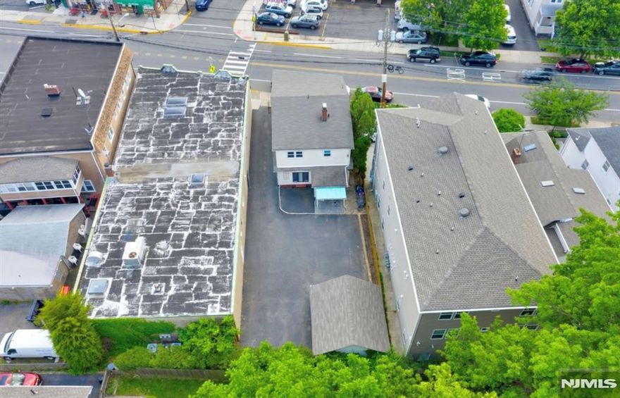 NEW ROOF IN 2023! 106 Broughton is making its DEBUT TO MARKET! This exceptional TWO-family property in one of Bloomfield's most desirable, commuter-friendly neighborhoods. Just a short stroll to the NYC bus and just minutes from the Midtown Direct train. This is truly an asset * not-to-be-missed * that offers 3 bedrooms, 1 full bathroom, kitchen, dining room & living room on each floor. This prime location offers a private driveway, detached 2-car garage, and safety cross-walk. Both units are well maintained and feature spacious layouts, separate utilities, with updated kitchens & bathrooms; delivering both comfort and strong rental appeal. The landlord pays for water and there is a fully finished walk-out basement that houses a coin-operated washer/dryer. Additional highlights include a summer kitchen & full bathroom in the walkout basement. A rare opportunity for the savvy investor, first-time landlord, or owner-occupant. (photos are approx 3 years old) *** OPEN HOUSE *** TBA *** PRIVATE DRIVE, PRIVATE PARKING, 2-CAR GARAGE *** Join my team for a guided tour!