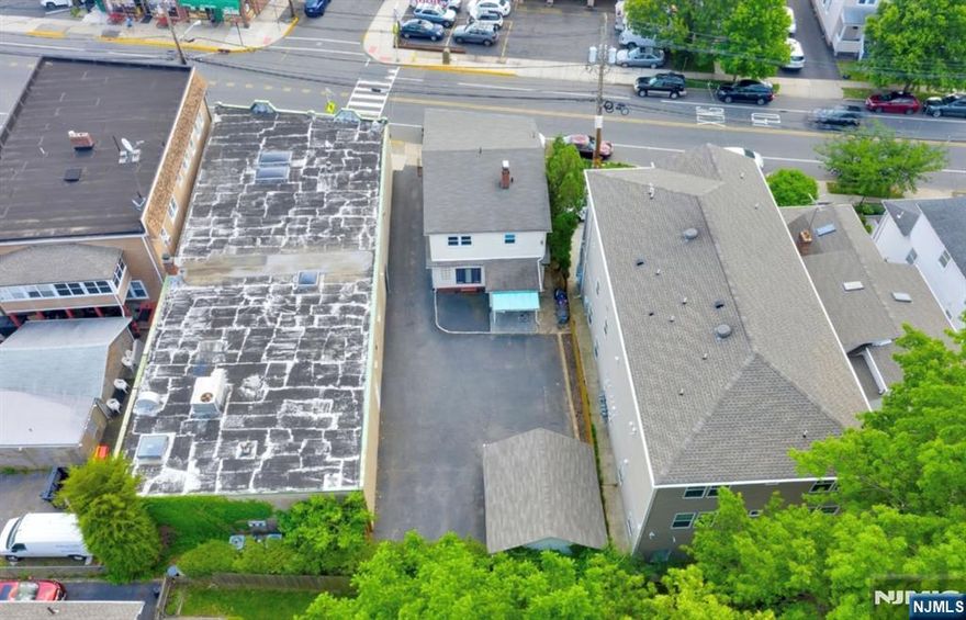 NEW ROOF IN 2023! 106 Broughton is making its DEBUT TO MARKET! This exceptional TWO-family property in one of Bloomfield's most desirable, commuter-friendly neighborhoods. Just a short stroll to the NYC bus and just minutes from the Midtown Direct train. This is truly an asset * not-to-be-missed * that offers 3 bedrooms, 1 full bathroom, kitchen, dining room & living room on each floor. This prime location offers a private driveway, detached 2-car garage, and safety cross-walk. Both units are well maintained and feature spacious layouts, separate utilities, with updated kitchens & bathrooms; delivering both comfort and strong rental appeal. The landlord pays for water and there is a fully finished walk-out basement that houses a coin-operated washer/dryer. Additional highlights include a summer kitchen & full bathroom in the walkout basement. A rare opportunity for the savvy investor, first-time landlord, or owner-occupant. (photos are approx 3 years old) *** OPEN HOUSE *** is NOT YET SCHEDULED *** PRIVATE DRIVE, PRIVATE PARKING, 2-CAR GARAGE ***