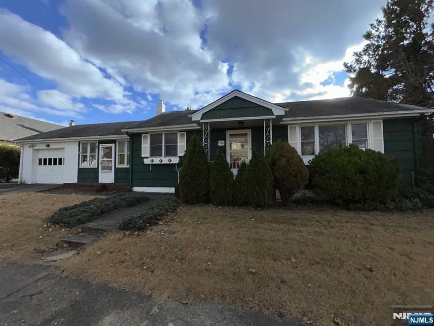 Spacious ranch style home on corner lot. Living room, large eat-in-kitchen, unheated breezeway from garage to kitchen with loads of potential for various options. (Den/dining room combination etc.) two bedrooms and full tile bath. Full, unfinished basement with high ceiling and walkout to back yard. Attached one car garage. Yard.