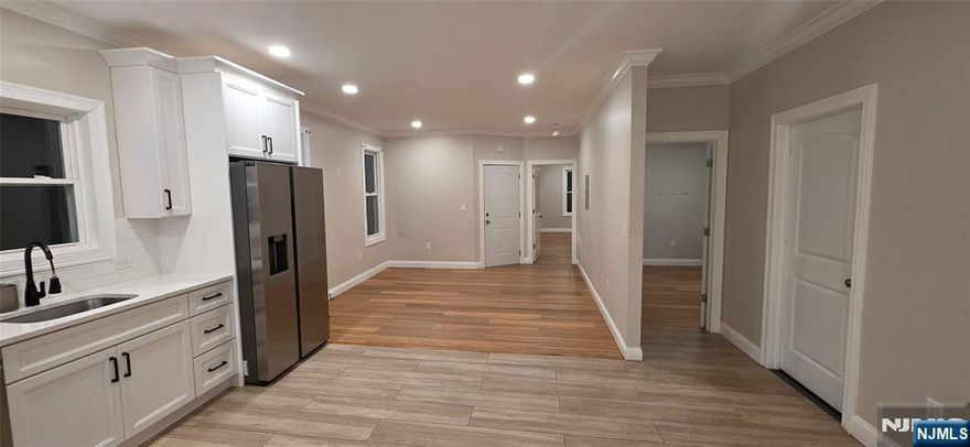 Welcome to this beautifully renovated 4-bedroom 1-Bathroom Apartment with all the natural light you would need & High Ceilings throughout. Foyer & Hallway exclusive to Apt. 1 only, Lead to the Washer/Dryer Hookup in the Basement. This apartment has a Kitchen, Dining, & Living Room Open Concept layout. Huge 2 Car Garage option Available. All Utilities are separate, and 4 car driveway parking is included. Close to Schools, Public Transportation, Restaurants, Parks & Shopping. Easy access to Rt. 21, Rt 3, Rt 80 & Rt 46.