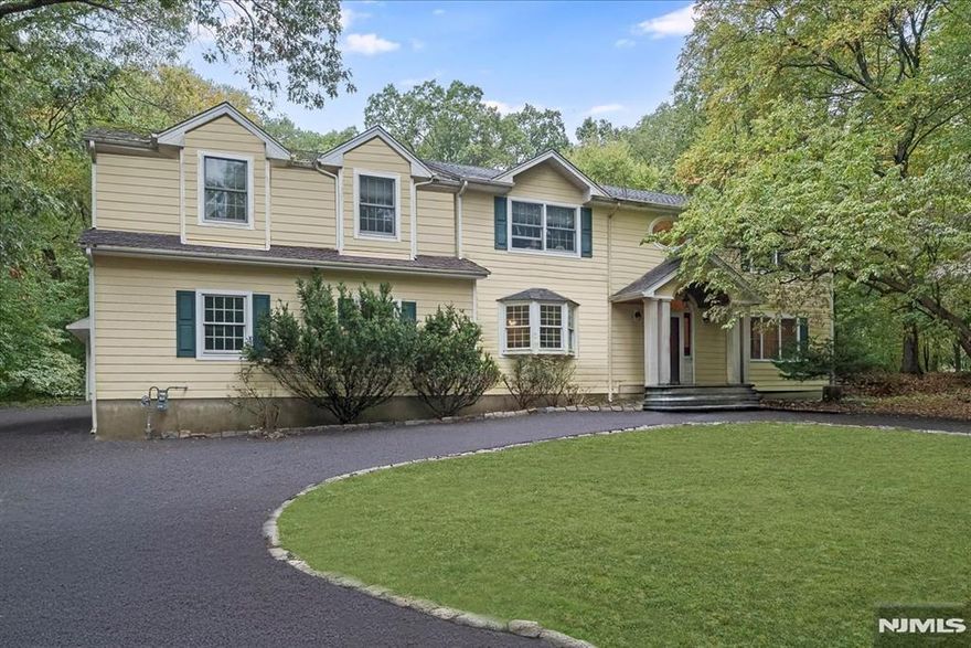 Private 6-Bedroom Colonial on 1.29 Acres with Pool End of Cul-de-Sac in Franklin LakesTucked at the end of a quiet cul-de-sac, this expansive Colonial offers over 4,100 sq ft of beautifully maintained living space on 1.29 private, wooded acres. A rare find in Franklin Lakes, the home features 6 bedrooms, 3.5 baths, a finished basement, and a backyard oasis with an in-ground pool surrounded by brand-new safety fencing (2024). The main level includes a large eat-in kitchen with granite countertops and tile flooring, a cozy family room with fireplace, formal dining with built-in cabinetry, and a screened-in porch that opens to a spacious rear deck ideal for entertaining. Upstairs, you'll find five additional bedrooms and three full baths, while the basement adds bonus space for recreation, gym, or media. The home is set on well water with updated septic and features multi-zone central air, gas heat, and a circular driveway for easy in/out access. Located just minutes from top-rated schools, town fields, and local parks, this home combines quiet retreat living with everyday convenience, perfect for those seeking space, privacy, and timeless comfort.