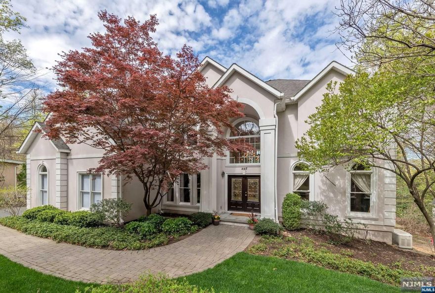 OWNERS WILL ACCEPT BEST & FINAL OFFERS BY 4PM TUESDAY, 5/21 Step into this East Hill Englewood home that effortlessly blends sophistication and relaxation, providing the perfect balance throughout every inch of living space. From the moment you enter, you'll be greeted by an abundance of natural light designed for style and comfort. The layout is perfect for both intimate gatherings and larger get-togethers with spacious living and dining areas. The first floor also features an ensuite guest room, family room and updated modern kitchen with ample storage and easy access to a spacious deck, perfect for outdoor entertaining. The second floor boasts four additional bedrooms, two ensuite one of which is the luxurious primary and 2 bedrooms connected by a Jack and Jill bathroom. The ground level walkout is a haven for entertainment and relaxation, featuring a spacious recreation room, an additional bedroom, and a gym.