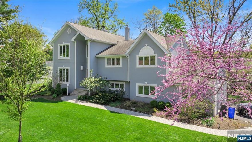 Welcome to this beautifully maintained expanded split-level in Closter, set on a quiet residential street. As you first walk in, youâ€™re greeted by high ceilings that create an immediate sense of openness and light. This home offers a well-balanced blend of space, function, and location. The main level features a comfortable living room that flows into the dining area and kitchen, creating an easy layout for both everyday living and entertaining. The split-level design provides separation of spaces while maintaining a natural flow throughout the home. This residence offers 3 generously sized bedrooms and 3.5 bathrooms, along with additional flexible living space and a dedicated office area. The primary suite is privately situated and impressively spacious, offering a quiet retreat with ample room to unwind. The primary bathroom and hall bathroom are both enhanced with skylights, bringing in beautiful natural light and creating a bright, airy feel throughout these spaces. A new AC unit and new furnace were also replaced in 2025, offering added comfort and peace of mind. The home is also equipped with a security system and an in-ground sprinkler system for added convenience. Closter is known for its charm and strong sense of community, making it a sought-after Bergen County town. A well-maintained home offering comfortable living in a desirable location.