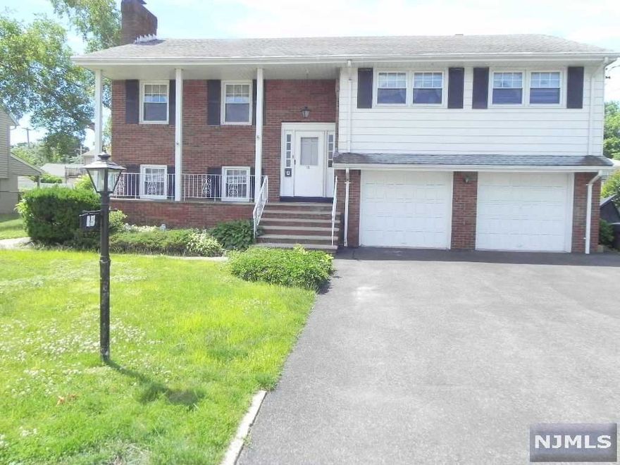 THIS 3 BEDROOM 2 FULL BATH HOME FEATURES ON THE 1ST FLOOR AN ENTRANCE FOYER, FOLLOWED BY A LARGE LIVING ROOM WITH A WOOD BURNING FIREPLACE, DINING ROOM, KITCHEN WITH BREAKFAST NOOK, 2 NICE SIZE BEDROOMS, FULL BATH AND LAUNDRY ROOM. THERE'S ALSO AN ENTRANCE TO THE DECK AND BACKYARD. THE GROUND FLOOR HAS A DEN OR FAMILY ROOM, LARGE EAT IN KITCHEN, BEDROOM, FULL BATH AND UTILITY ROOM. THERE IS ALSO ENTRANCE TO THE 2 GARAGES AND A SECOND ENTRANCE TO BIG BACKYARD. CLOSE TO SCHOOLS, SHOPPING AND NYC TRANSPORTATION.