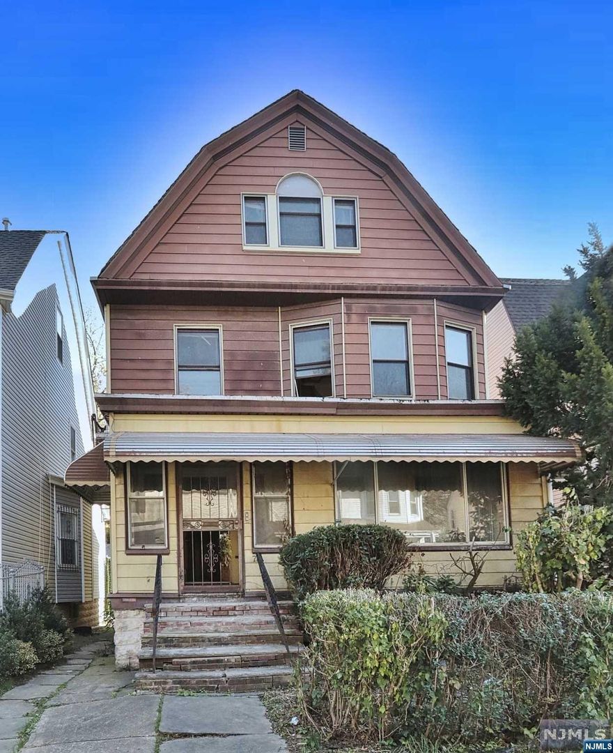 Own this 2 family home on a quiet tree lined street with detached garage. This is a blank page where you can pick up where the previous owner left off and take advantage of work already done. The home is gutted down to studs and beams with major emphasis put on the floor plan, making for great space. Will need sheetrock, insulation, electric and plumbing. Full unfinished basement with potential for additional living space. Home sold as-is cond. Buyer responsible for all inspections and East Orange municipal certs, including temp C/O. Perfect for Investors or rehab owner occupant.