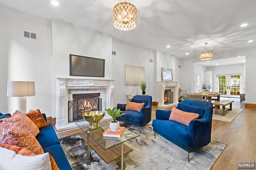 Luxury, location, and convenience come together in this rarely available brownstone townhouse that sits on a 25'x100' lot. Located on one of Downtown Jersey City's most desirable tree-lined streets, this home is a must see! The two family residence was renovated in 2018 with all new systems including plumbing, electrical, three HVAC's, two gas fireplaces, two terraces and an amazing 25'x47' garden area. This historic turn-of-the-century brownstone has seven bedrooms, two living rooms, two dining rooms and five and one half bathrooms. The property exemplifies seamless integration of modern living and beautifully restored historic detail. The Garden level of the property is a two bedroom, two full bath apartment, currently lease out at $2,775 per month. An easy commute to the Grove PATH. The home is located near neighborhood restaurants, the Newport Mall, Hamilton and Van Vorst Parks and all that the Jersey City Waterfront has to offer. - Some bedrooms are virtually staged -