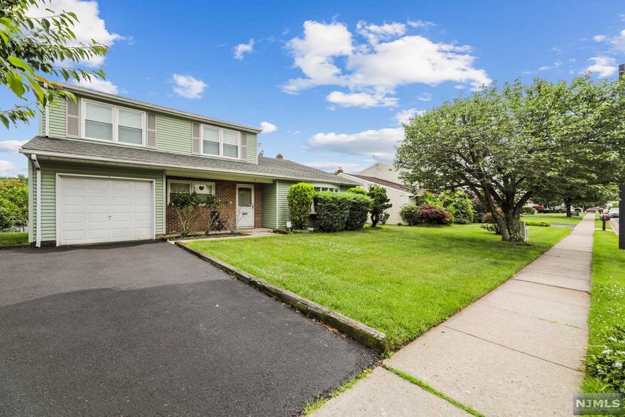 This spacious split - level is ideally located between U.S. Route 1 and New Jersey Turnpike, close to shopping, schools, transportation and houses of worship. Close to Edison Station with access to NYC. Home offers 4 bedrooms, 2.5 bathrooms, Living Room, Family Room, Dinning Room, spacious Eat-In-Kitchen, Basement and 1 car Garage. Front porch leads to Entry Foyer. First level offers Powder Room, Bedroom, and Family Room with sliders to deck overlooking nice size yard. Spacious Formal Living Room flows into the Formal Dining Room and Kitchen. Upstairs offers a Master Bedroom with a master bath, two additional bedrooms and a full bath. Turn this home into your dream home! One year Home Warranty included. House Sold "As Is"