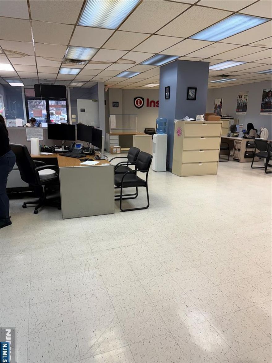 1838 SF ground-floor office space at 54 Main Street featuring a large open work area ideal for collaborative use, two private office rooms, and a private bathroom. Convenient street-level access makes this space easy for clients and staff. A free city parking lot located directly across the street adds exceptional convenience. Flexible layout suitable for a variety of professional uses. Floor plans available upon request.