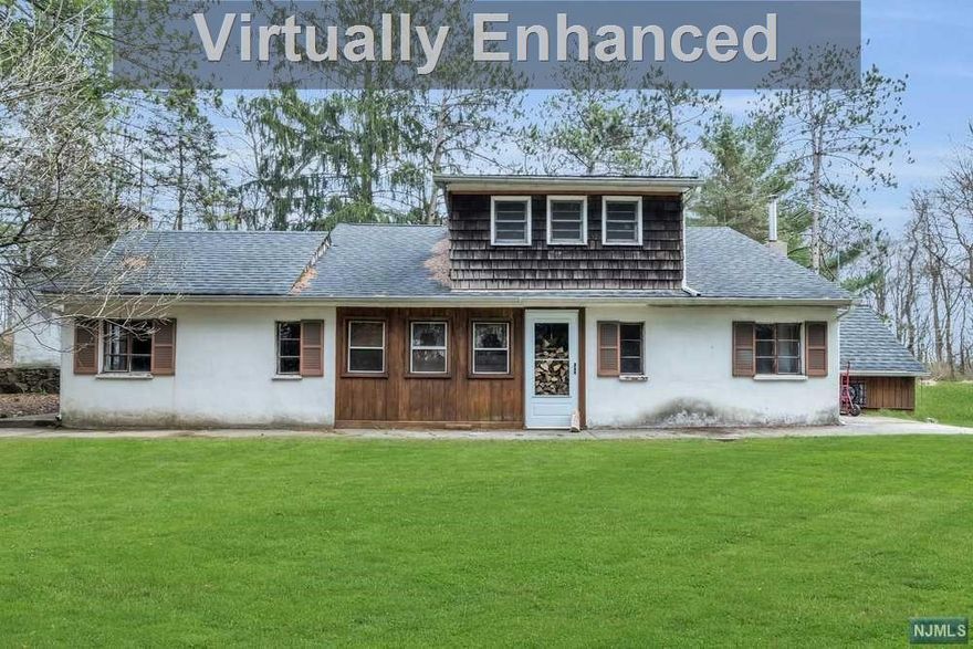 This is a beautiful location with tons of privacy on the mountain. Enjoy the peace, quiet and serenity of nature! Long driveway with lots of parking. A garage with a workshop and a fireplace, yes a fireplace in the garage! Two enclosed porches. New roof and newer well and oil tank. This home has a wood burning fireplace and a wood burning stove. Only minutes from Merrill Creek Park and great restaurants. This is a well built home, ready for your personal touch. Home is being sold AS IS.