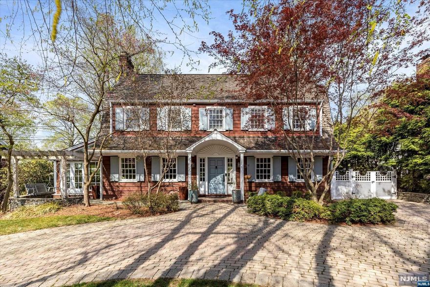 Sought After Park Avenue Location! Spectacular 3,500 SF Colonial on Half an Acre with Tennis Court! From the circular driveway enter a spacious center hall to find a large dining room with custom stained-glass windows. The living room with dual stone FPL opens to a sun-filled family room with radiant heat as well as a spacious library with powder room. The high-end kitchen features custom cabinets, Wolf stove, marble counters, Italian sink, beverage station with sink, and laundry area. The primary BR on the 2nd floor has a large walk-in closet and its own custom BTH complete with marble flooring, radiant heat, Corian tub, and skylight. 3 more BRS with large custom closets complete the 2nd floor along with an updated custom BTH. The 3rd floor with high ceilings gives you 2 more BRS and BTH with tub and custom Italian tiles. Kitchen sliders open to the beautifully landscaped park-like backyard with patio, tennis court, and 2 car garage. Note: cameras in house.