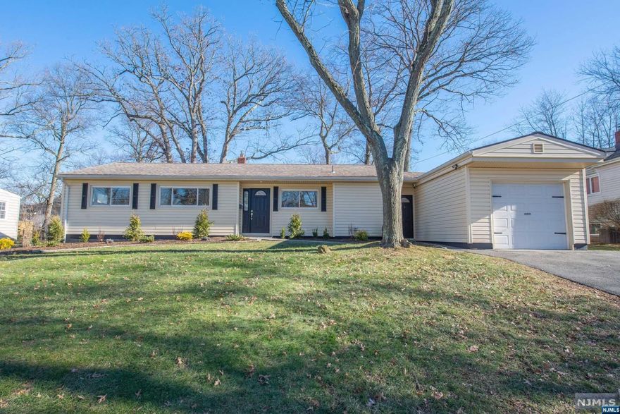 Beautifully updated Ranch with a foyer entry offers it all! Gorgeous eat-in kitchen with farm sink, quartz counters, breakfast bar, stainless steel appliances, lots of cabinets, built-in pantry, laundry closet and access to breezeway/garage. Living room with electric fireplace, dining room, family room with sliders to patio and level back yard. Primary bedroom with en suite and double closets. 2 additional confortable bedrooms with great closet space. All neutral decor and great location. Fall in love and make it yours!