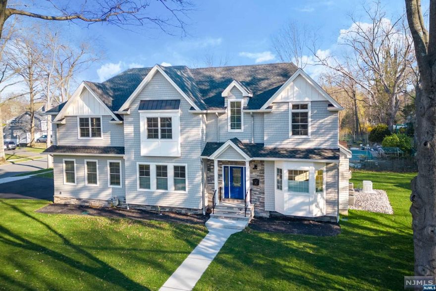 Stunning CUSTOM BUILT 2023 NEW CONSTRUCTION completed with the highest quality materials in the heart of Glen Rock. Abutting a quiet double cul-de-sac with a 5,400SF interior (+1,980SF attic), this 6 bedroom, 4.5 baths center-hall colonial boasts curb appeal & amenities galore. Notables include an open concept, hardwood floors, 8-12 ft ceilings, high-end fixtures & tile, 20 closets, private fenced yard, 2 fireplaces, 1st-fl BR/office, oversized heated 2-car garage w/ Tesla charging, whole house generator & custom blinds throughout. Open family room and gourmet eat-in kitchen at the heart of the home with high-end appliances, quartz countertops, custom walnut cabinetry/island, hood that opens electronically for flat screen tv, butler pantry & patio entry. Primary & secondary suite offer spa-like baths w/heated floors. Entertainer's dream basement: huge walnut wet bar, gym, full bath. A+ location only 35 min from NYC near 2 direct trains & top-rated schools. A true luxury home!