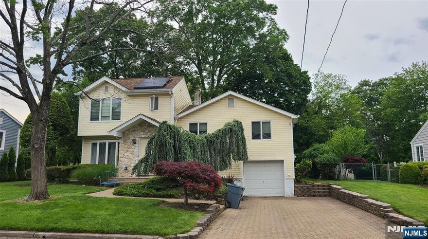 Welcome to this updated and well maintained tri-level residence located in one of Cresskill's quite residential areas. This home features 4 bedrooms ,3full bath, expansive great room ,huge open kitchen with a center island , skylights and sliding glass door to patio. Enjoy beautiful hardwood floors throughout the home. The lower level can serve as a playroom, home office, or den and includes a full bath and laundry area. Paver driveway with parking for up to 4 cars Just one block from the childrenâ€™s playground, and top-rated schools, with convenient access to NYC transportation, Solar panel installed.