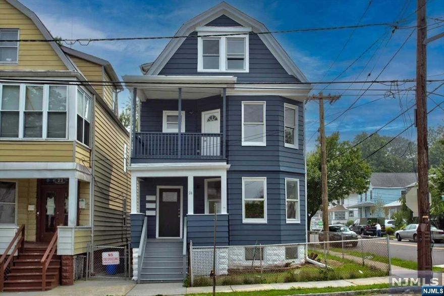 2 family totally renovated with unfinished basement and garage.